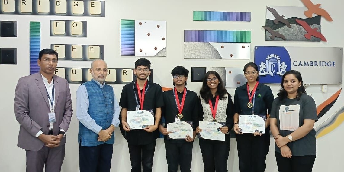 Team members receiving certificates at the Cambridge event
