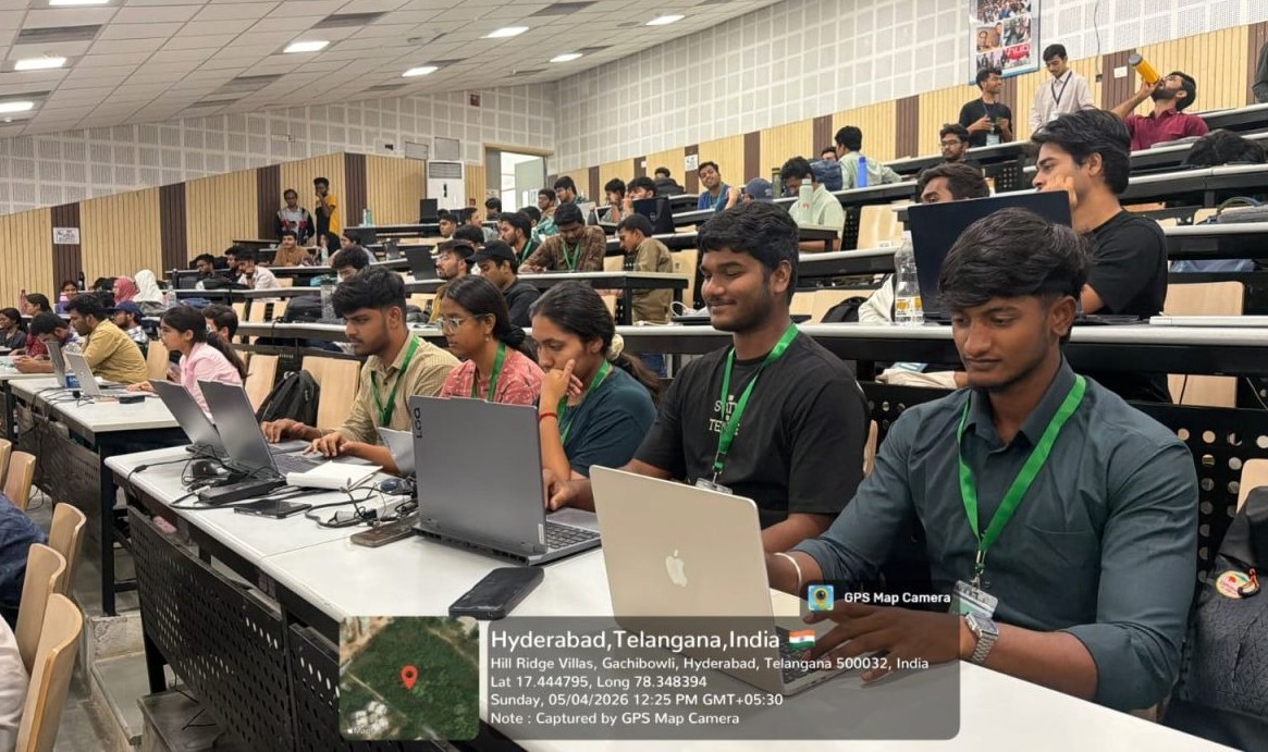 Participants working together in a busy hall