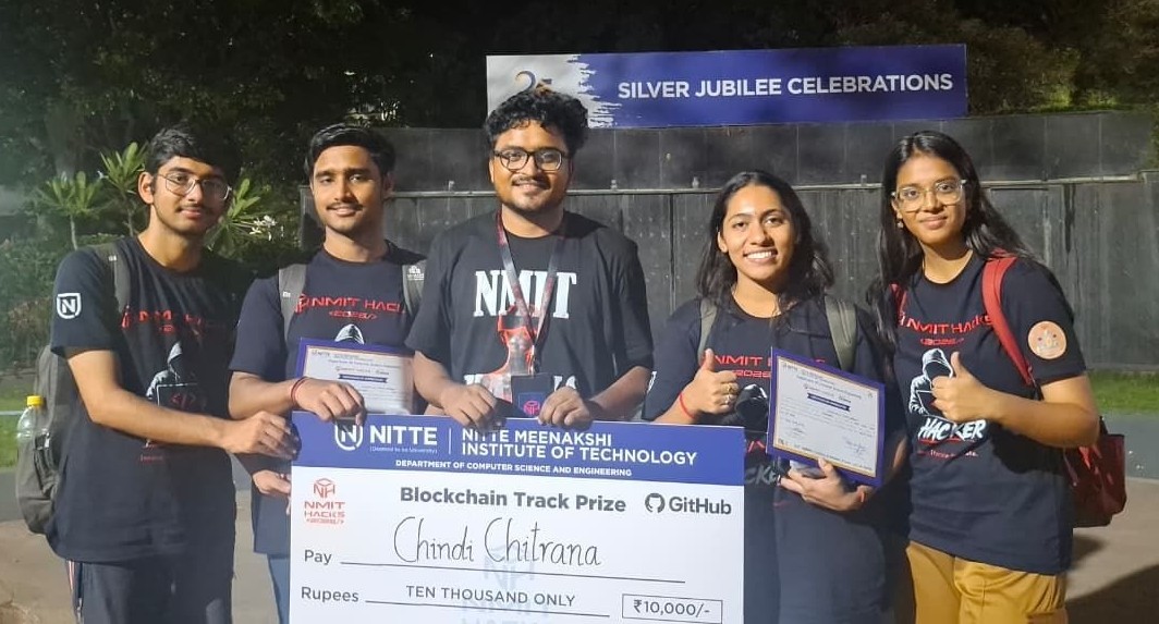 A team celebrating a blockchain track prize