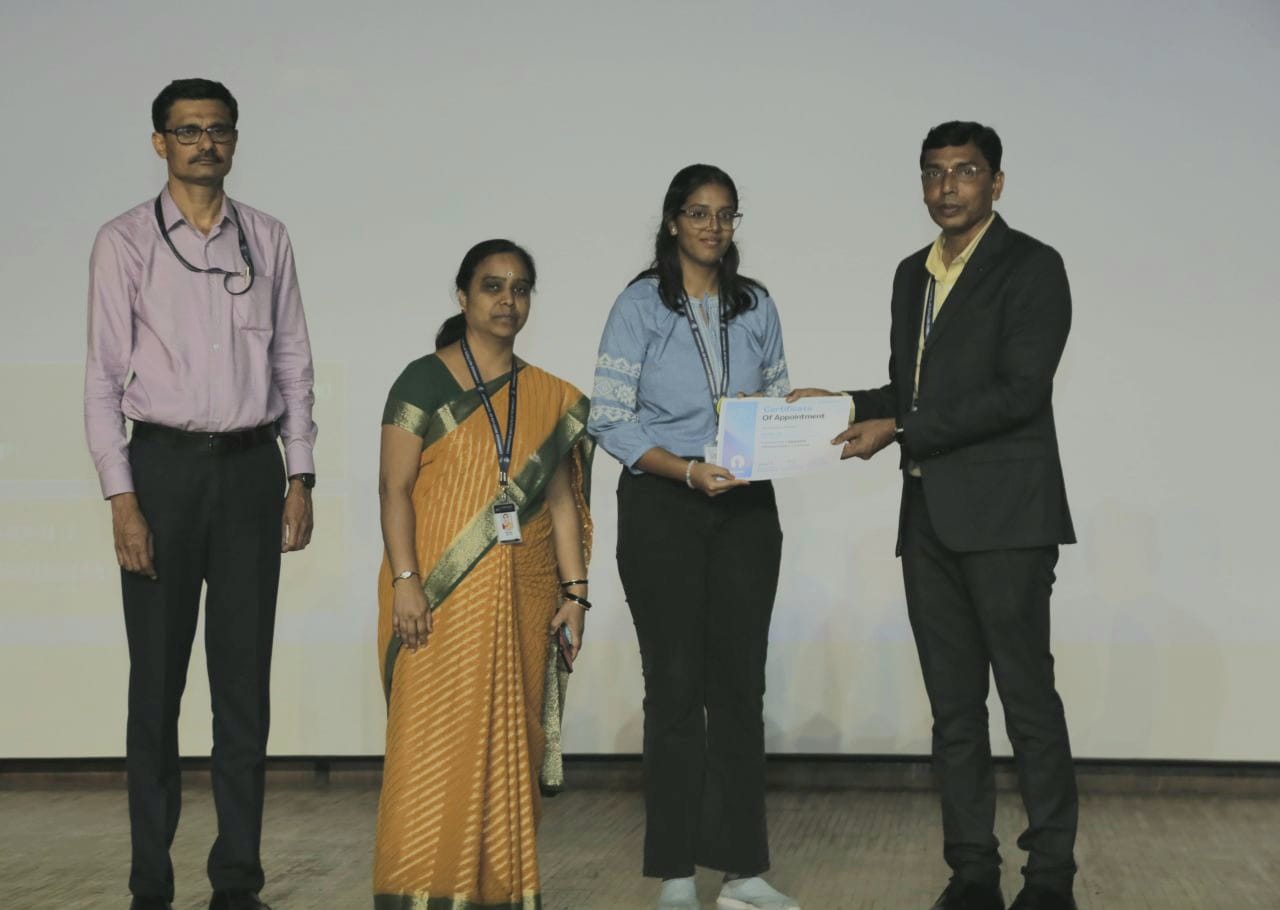 A certificate presentation with faculty members