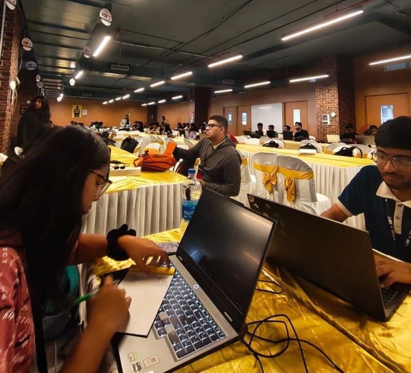 Participants continuing their work at a laptop